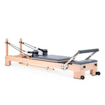 Elina Pilates Lignum Reformer Bundle showcasing waterproof beechwood design and adjustable resistance features for a premium Pilates experience.