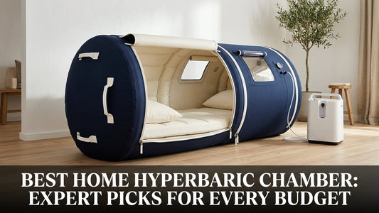 A navy blue soft-shell inflatable home hyperbaric chamber in a minimalist wood-floored wellness room with studio lighting.