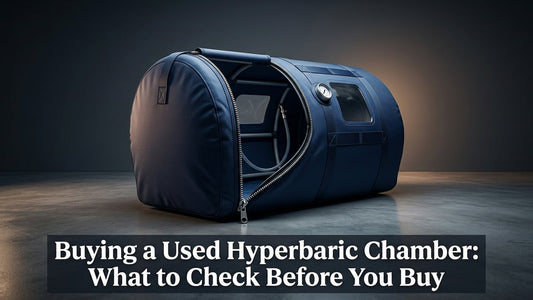 Premium portable hyperbaric chamber with open zipper entry in minimalist clinical setting with dramatic studio lighting
