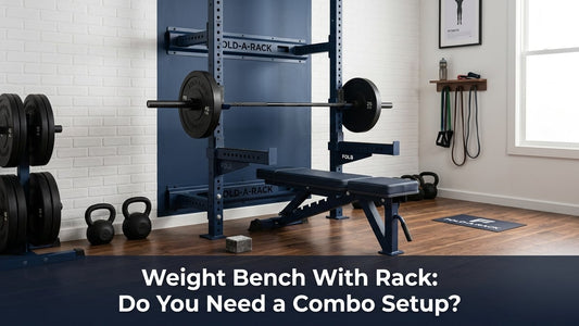 Cinematic home gym shot of a navy blue wall-mounted squat rack with folding bench and loaded barbell
