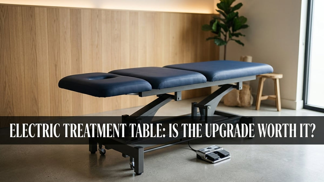Electric treatment table with navy upholstery in a minimalist clinical room with professional lighting