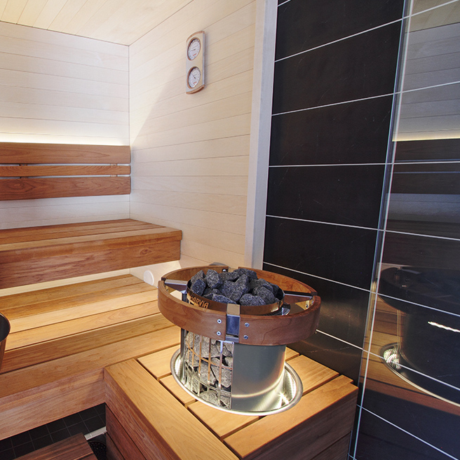 Ambiance created by the Harvia Cilindro PC60E Sauna Heater 6kW, showcasing the relaxing steam and cozy atmosphere it provides for sauna enthusiasts.