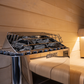 Harvia KIP60W 6kW Electric Sauna Heater Package for rooms up to 300 cu. ft., showcasing its sleek wall-mounted design and robust features for an efficient sauna experience.