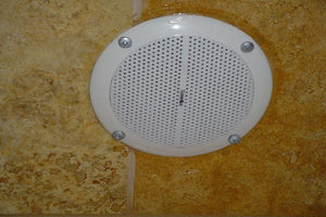 Close-up view of ThermaSol HOM-SPK-WHT Steam Shower Speakers, highlighting their waterproof features and exceptional sound quality for an enhanced bathing experience.